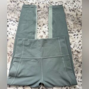 EUC Athleta salutation stash pocket 7/8 tight size XS